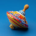 Push-Powered Humming Top
